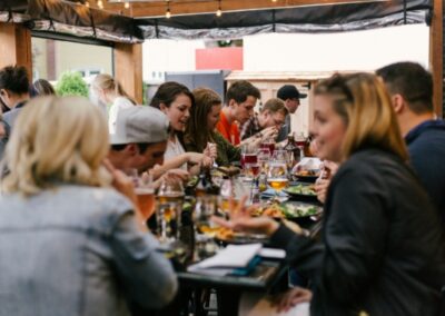 Sample Photo - A group of people eating at a large table